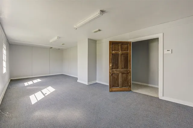 a white toilet sitting next to a shower