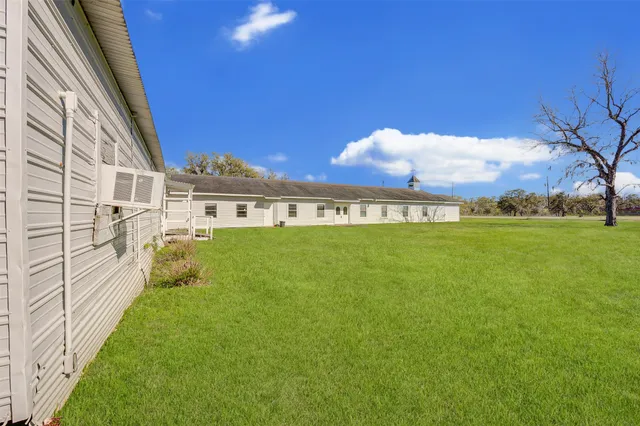 a view of front door and small yard