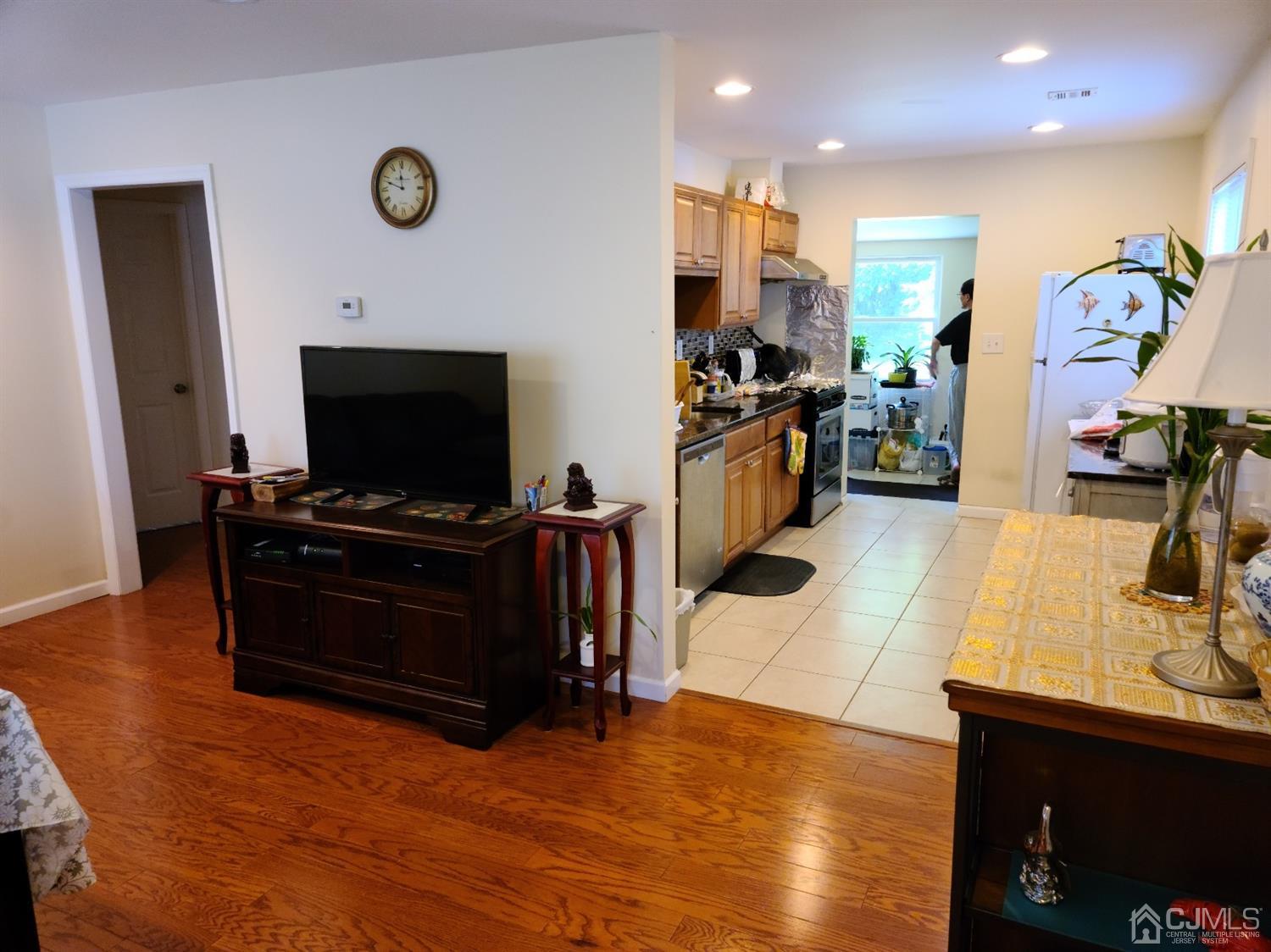 2 East Knollwood Road Edison, NJ 08817 - Photo 2 of 22 a living room with furniture and a flat screen tv