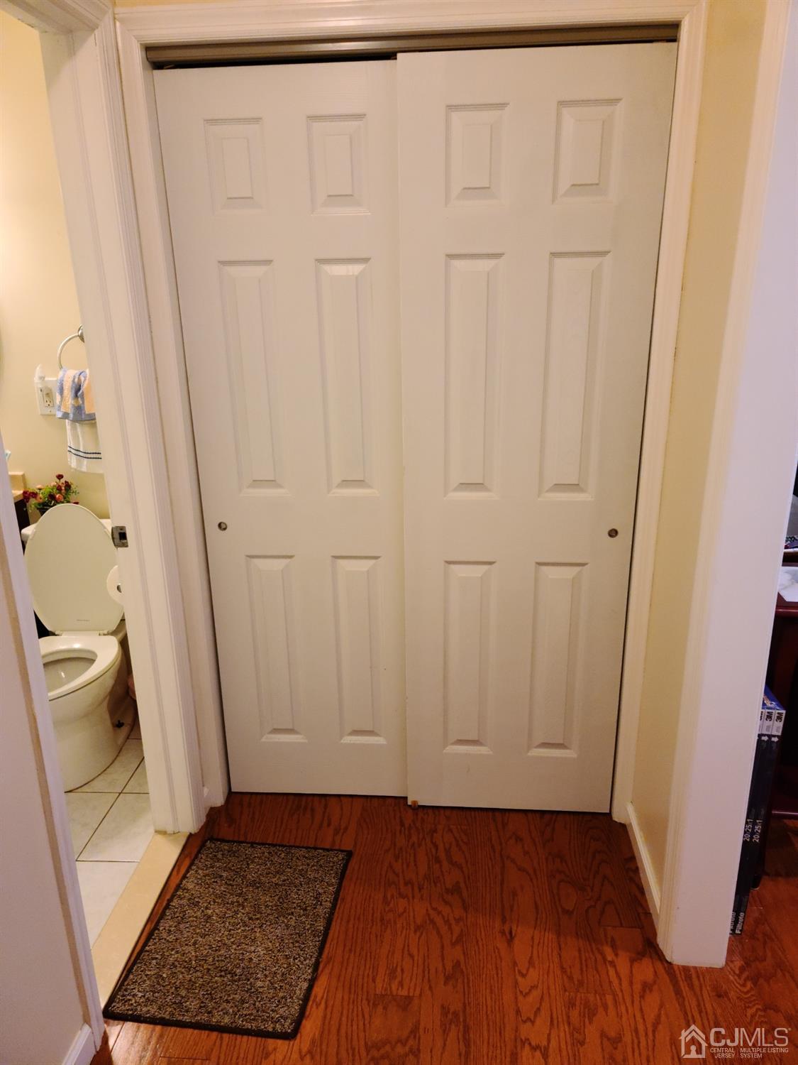 2 East Knollwood Road Edison, NJ 08817 - Photo 11 of 22 a view of an empty room with wooden floor and a sink