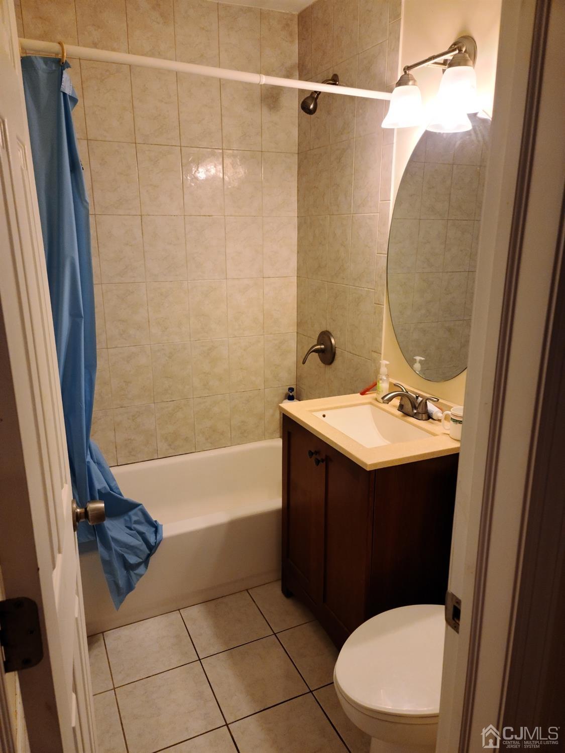 2 East Knollwood Road Edison, NJ 08817 - Photo 13 of 22 a bathroom with a sink vanity mirror and toilet