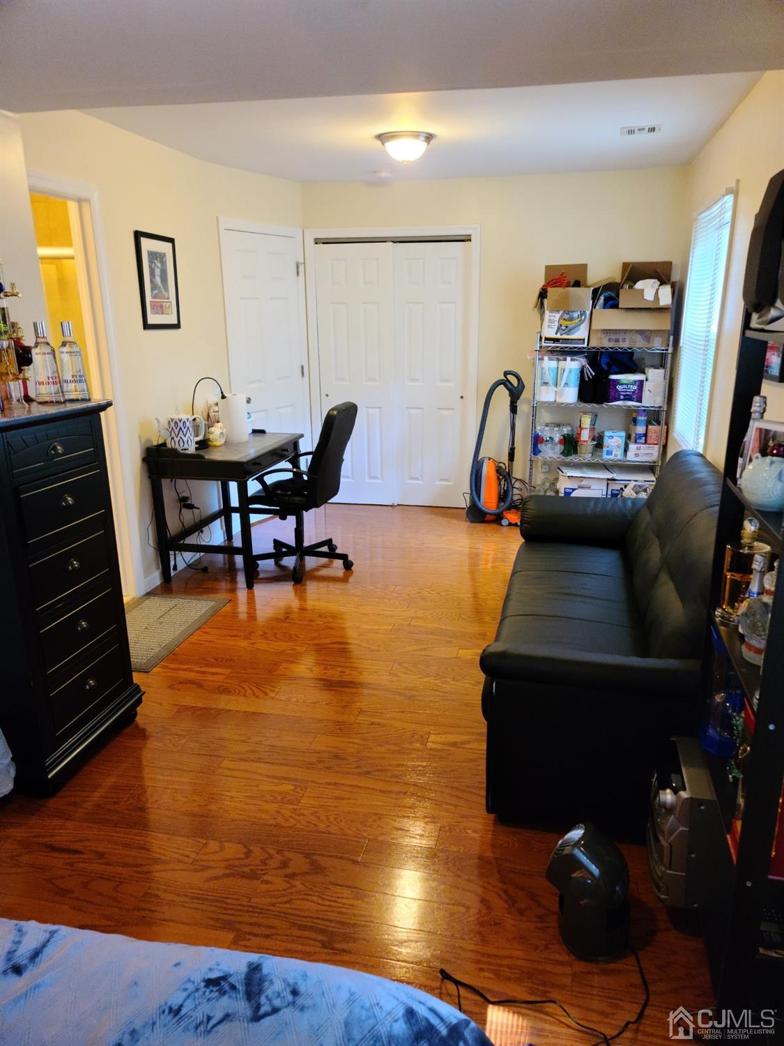 2 East Knollwood Road Edison, NJ 08817 - Photo 14 of 22 a living room with furniture and a flat screen tv
