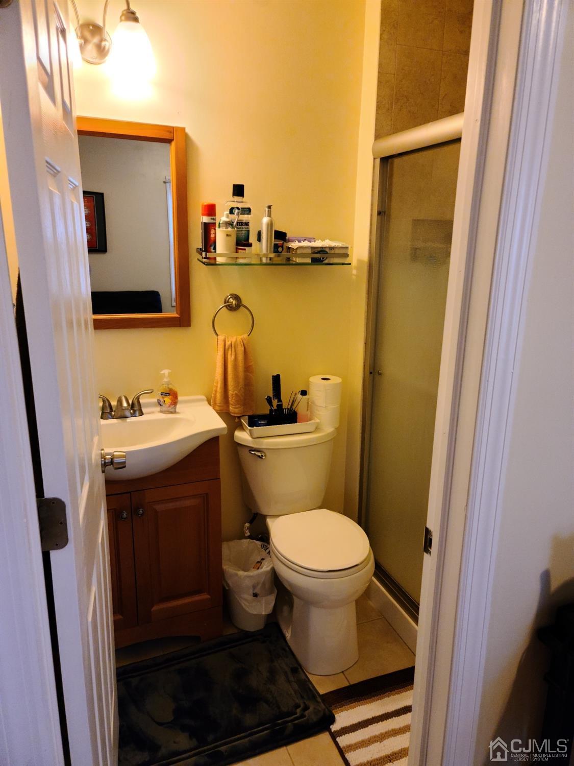 2 East Knollwood Road Edison, NJ 08817 - Photo 17 of 22 a bathroom with a sink and a mirror