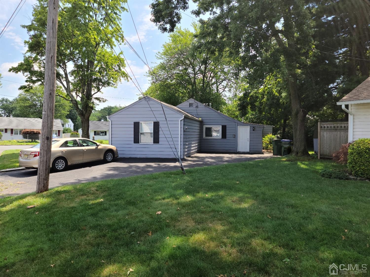 2 East Knollwood Road Edison, NJ 08817 - Photo 19 of 22 a house view with a sitting space and garden