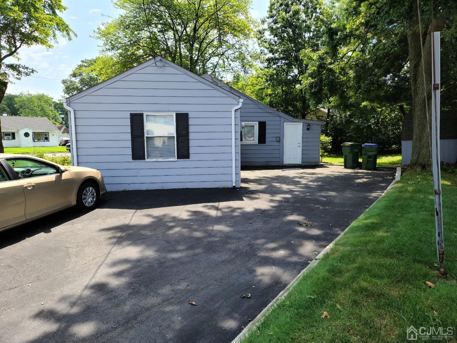 2 East Knollwood Road Edison, NJ 08817 - Photo 20 of 22 a view of a house with a yard