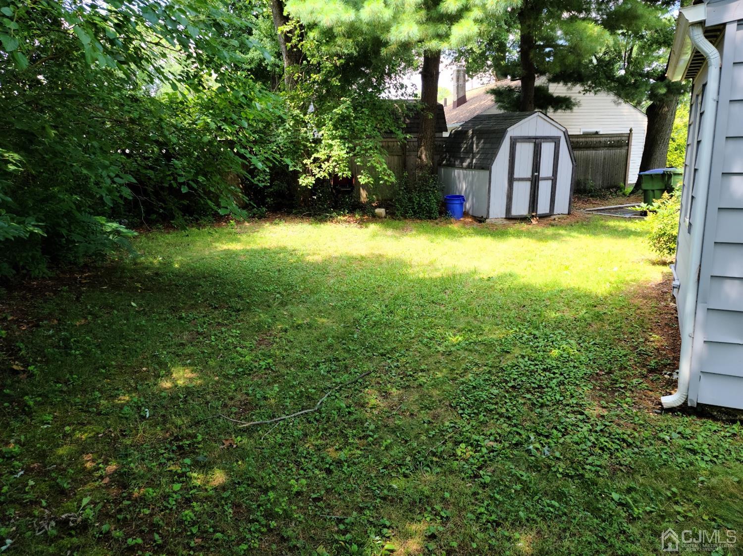 2 East Knollwood Road Edison, NJ 08817 - Photo 22 of 22 a view of a house with a yard garage and tree