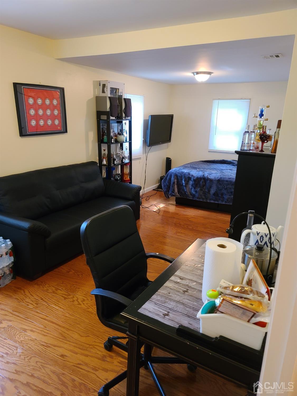 2 East Knollwood Road Edison, NJ 08817 - Photo 4 of 22 a living room with furniture and a wooden floor