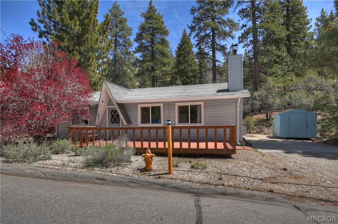 1099 Canyon Road Fawnskin, CA 92333 - Photo 31 of 39 a view of a house with a yard