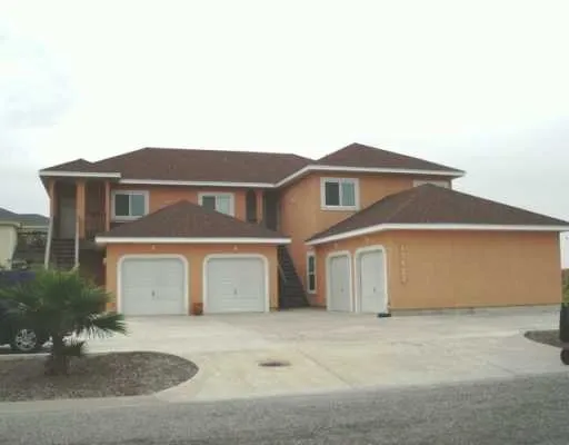 a front view of a house with a garage