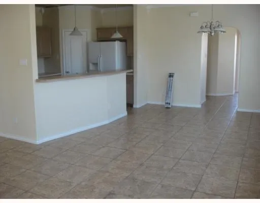 a view of a utility room with closet and mirror