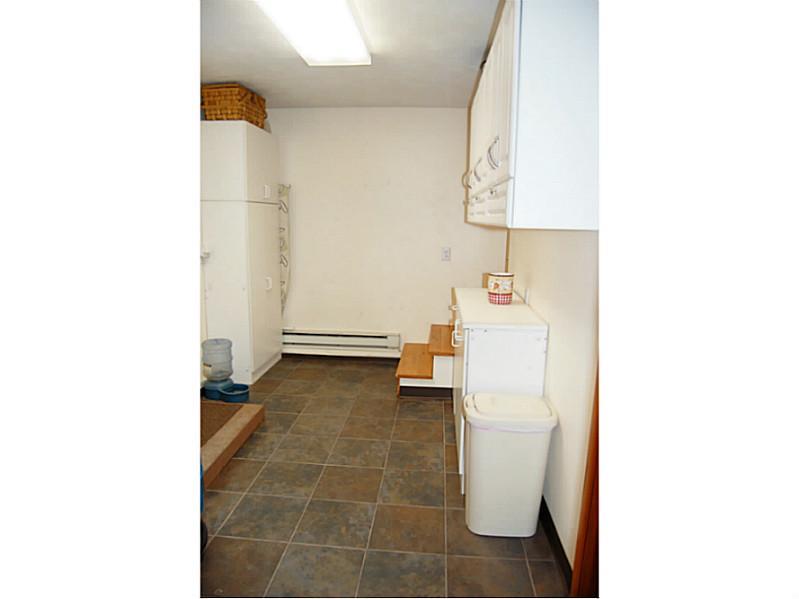 204 Snowshoe Road Acme, PA 15610 - Photo 11 of 25 Other. Ceramic tiled laundry area - spacious with nice storage!