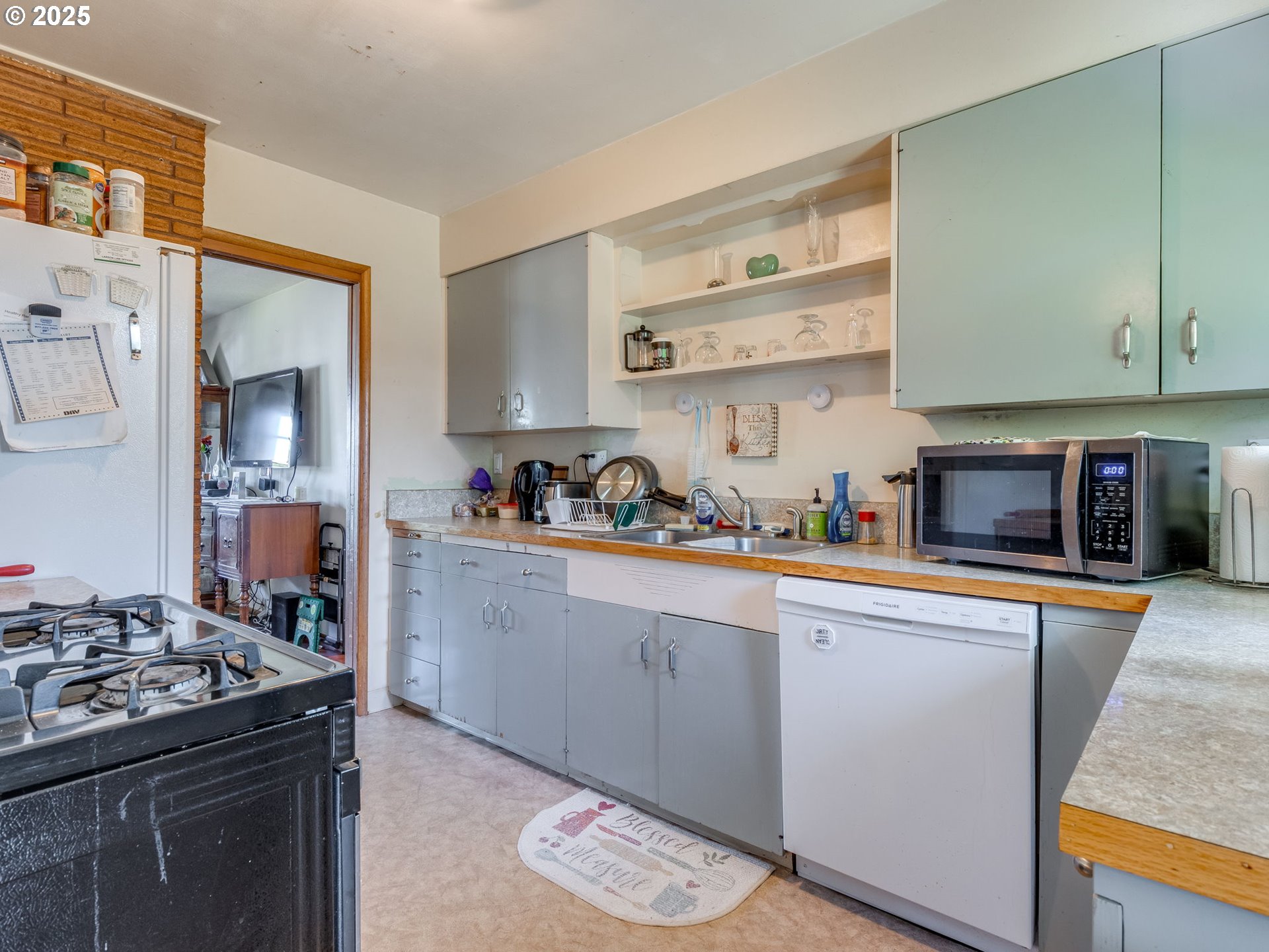 18010 Southeast Stephens Street Portland, OR 97233 - Photo 15 of 30 a kitchen with a stove and a sink