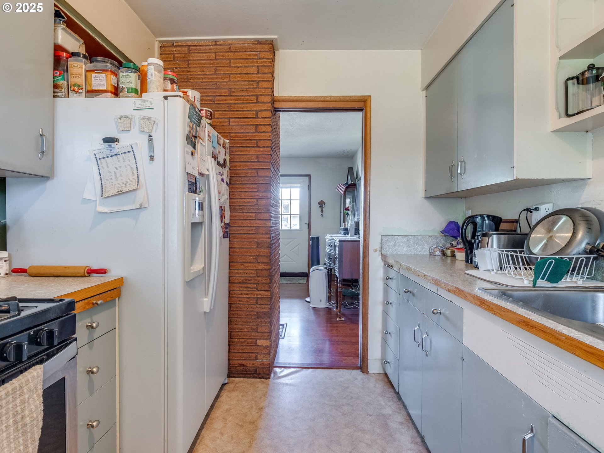 18010 Southeast Stephens Street Portland, OR 97233 - Photo 16 of 30 a kitchen with stainless steel appliances granite countertop a refrigerator and a sink