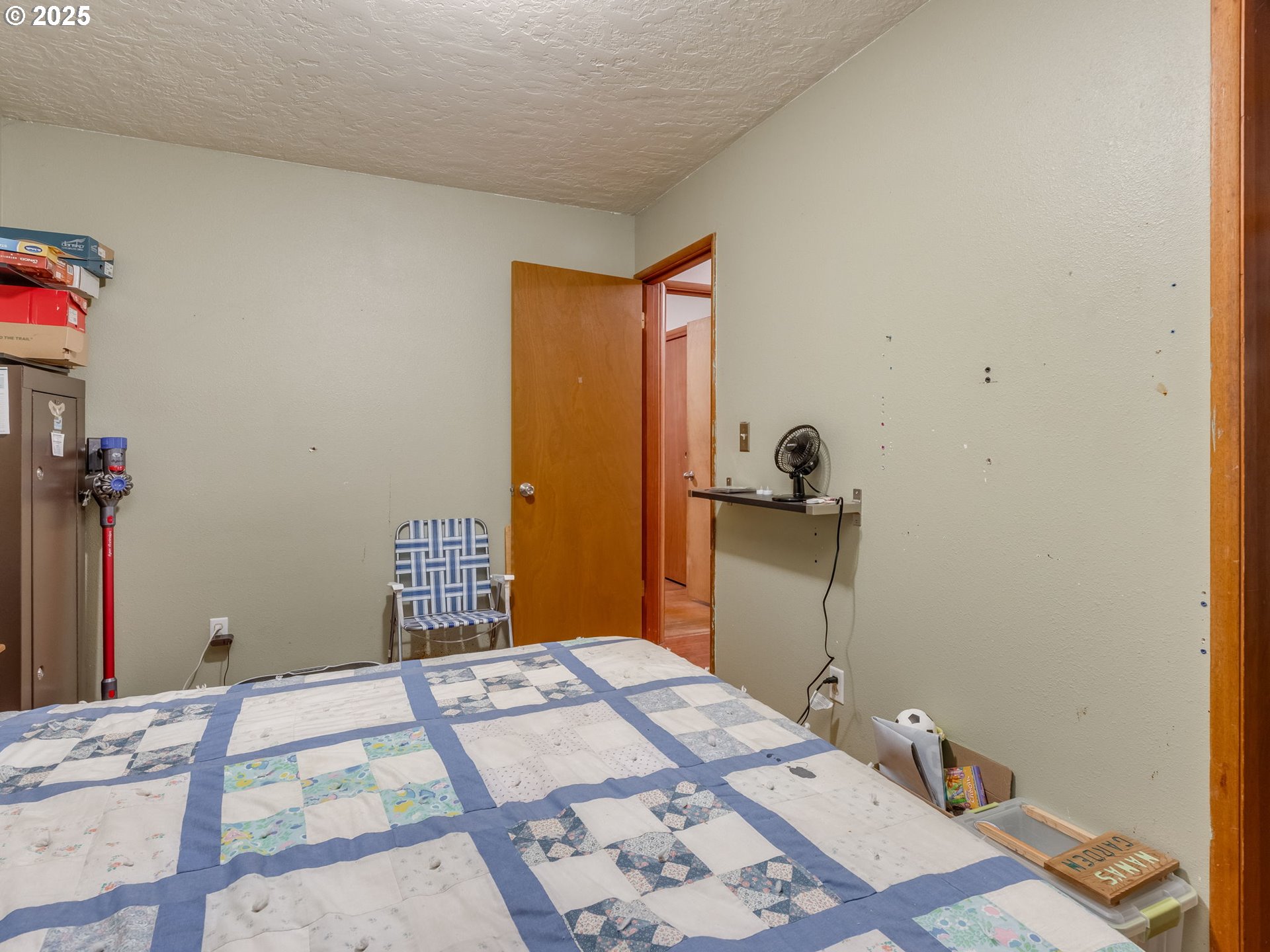 18010 Southeast Stephens Street Portland, OR 97233 - Photo 23 of 30 a bedroom with a bed and a dresser