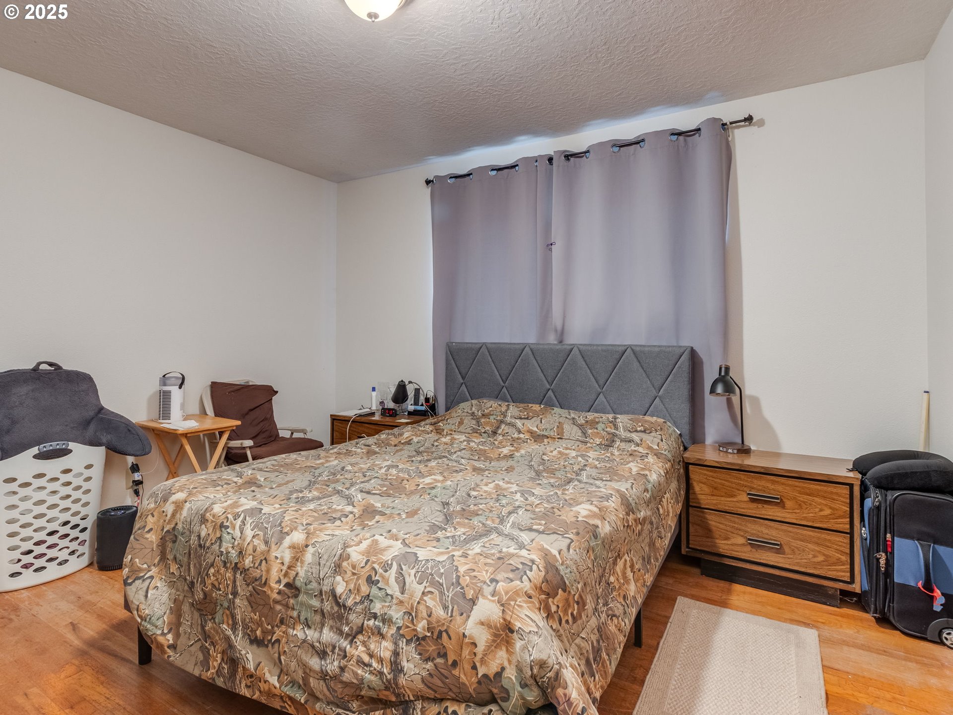 18010 Southeast Stephens Street Portland, OR 97233 - Photo 24 of 30 a bedroom with a bed and a cabinets