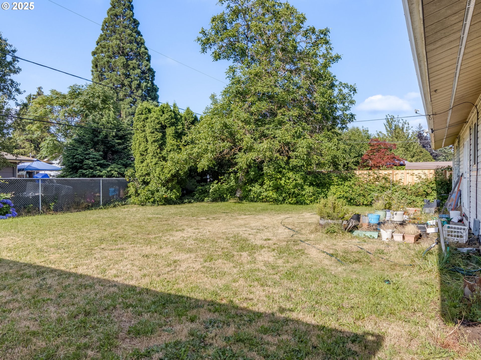 18010 Southeast Stephens Street Portland, OR 97233 - Photo 26 of 30 a backyard of a house with lots of green space