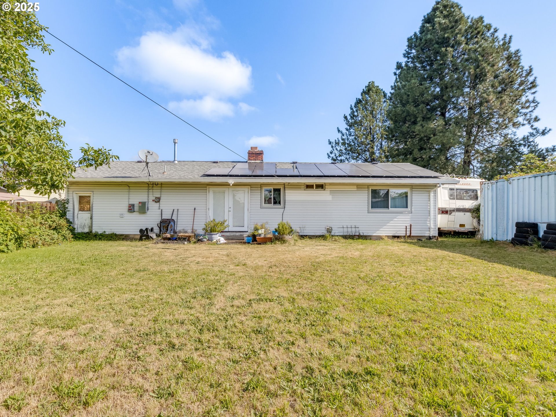18010 Southeast Stephens Street Portland, OR 97233 - Photo 28 of 30 a view of a house with backyard and a garden
