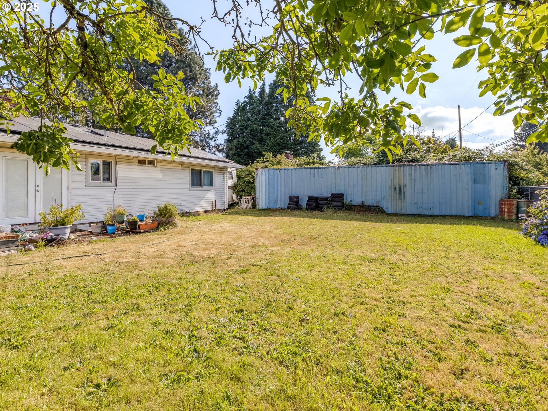 18010 Southeast Stephens Street Portland, OR 97233 - Photo 29 of 30 a view of a swimming pool and trees in the background