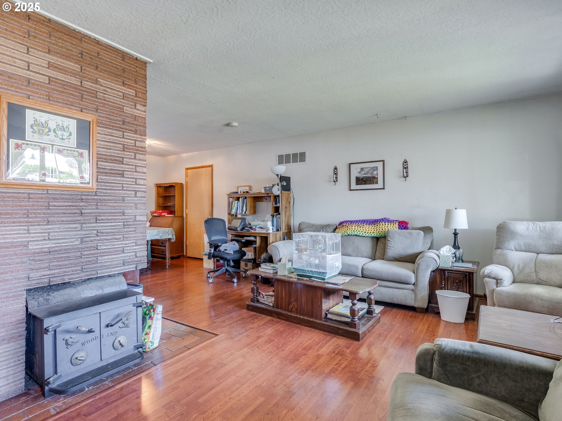 18010 Southeast Stephens Street Portland, OR 97233 - Photo 6 of 30 a living room with furniture and wooden floor