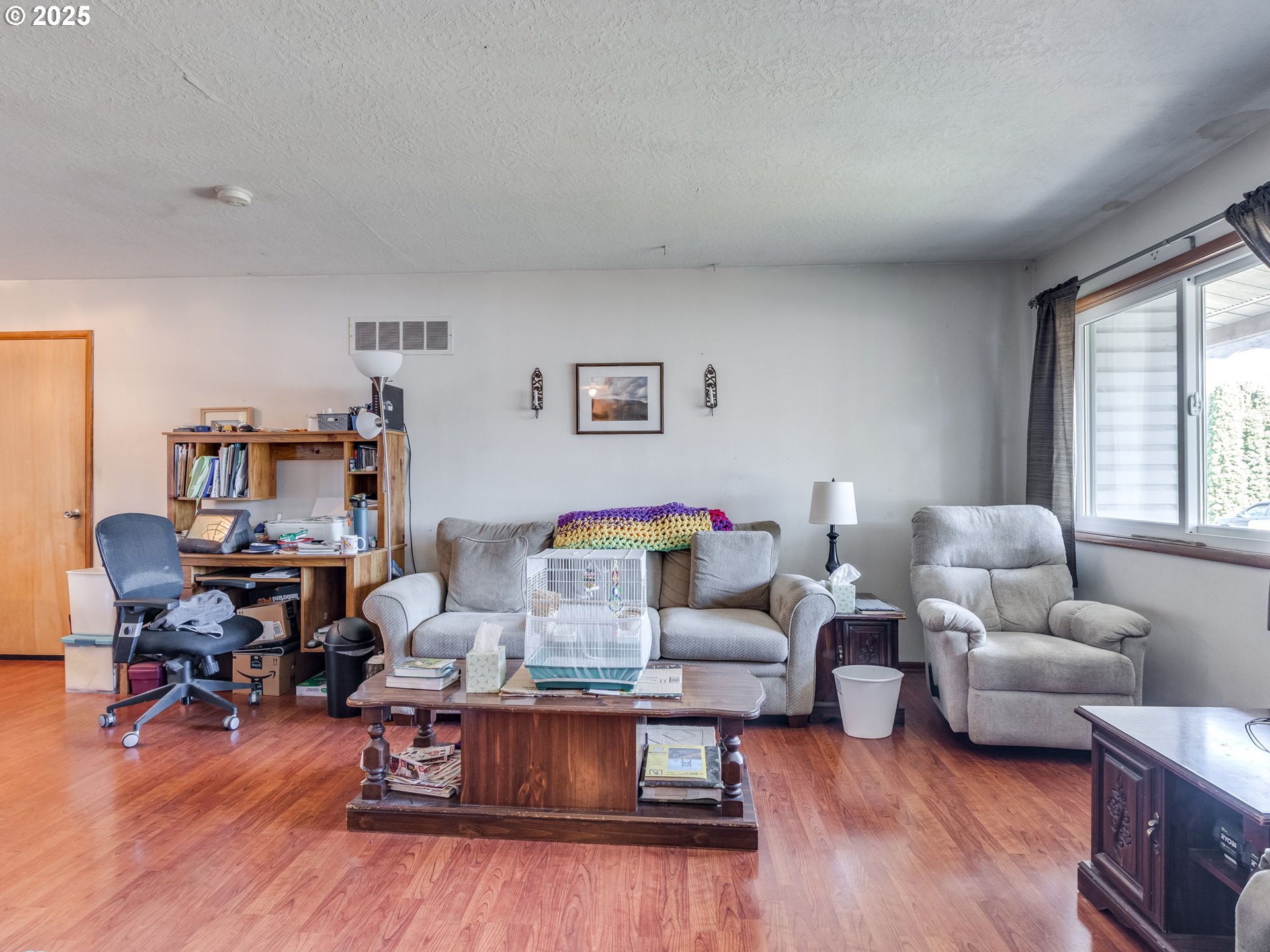 18010 Southeast Stephens Street Portland, OR 97233 - Photo 7 of 30 a living room with furniture and a wooden floor