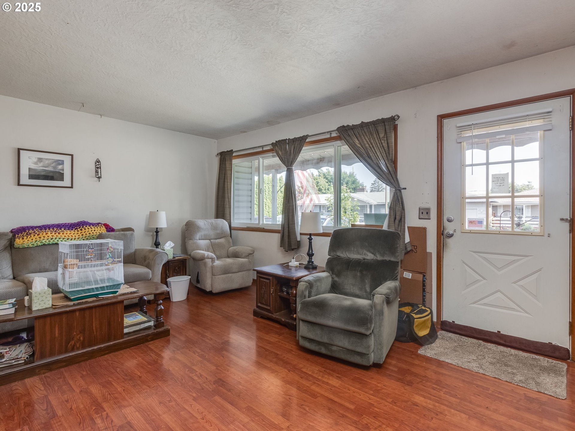 18010 Southeast Stephens Street Portland, OR 97233 - Photo 8 of 30 a living room with furniture and a window