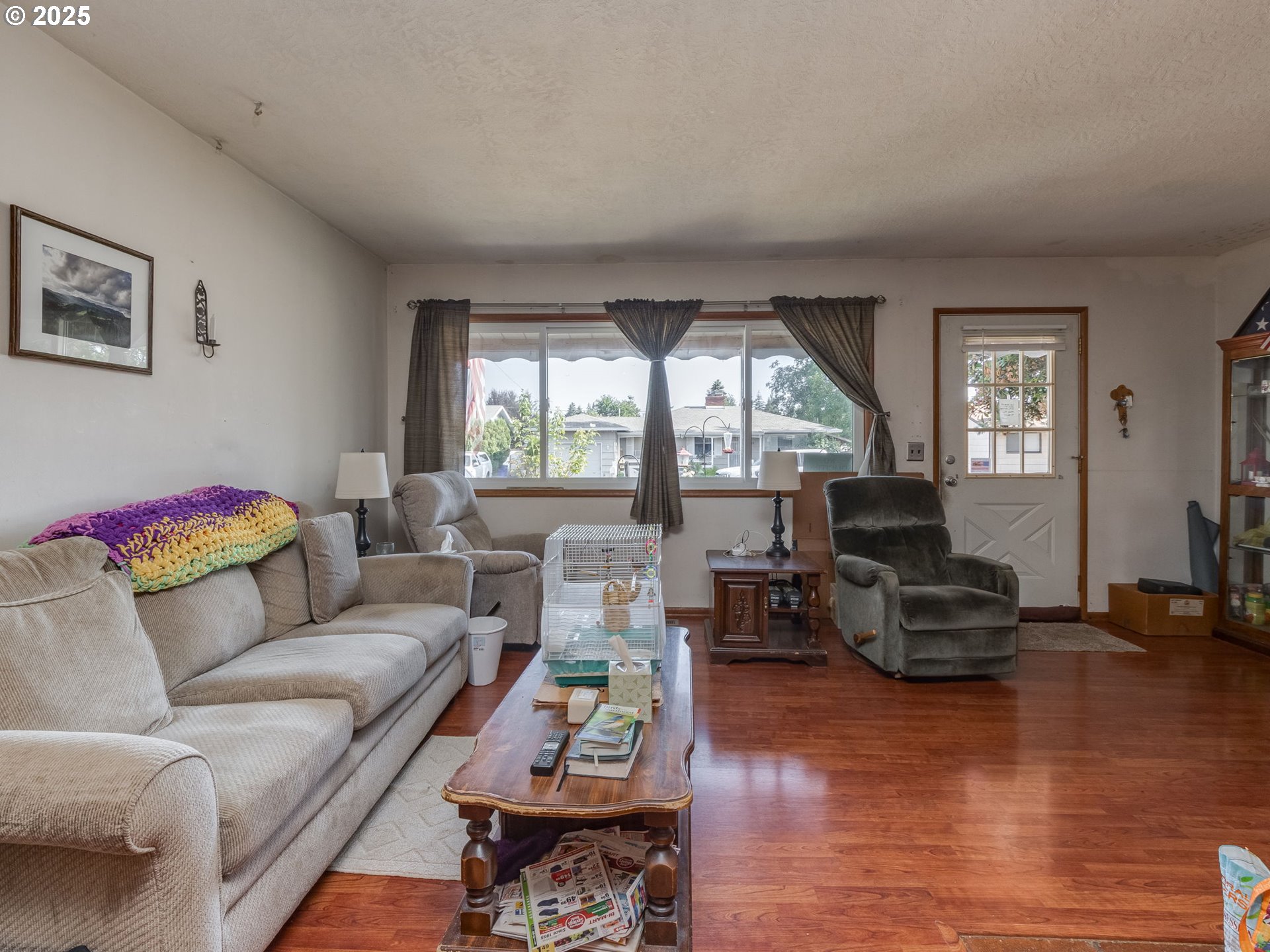 18010 Southeast Stephens Street Portland, OR 97233 - Photo 9 of 30 a living room with furniture and a large window