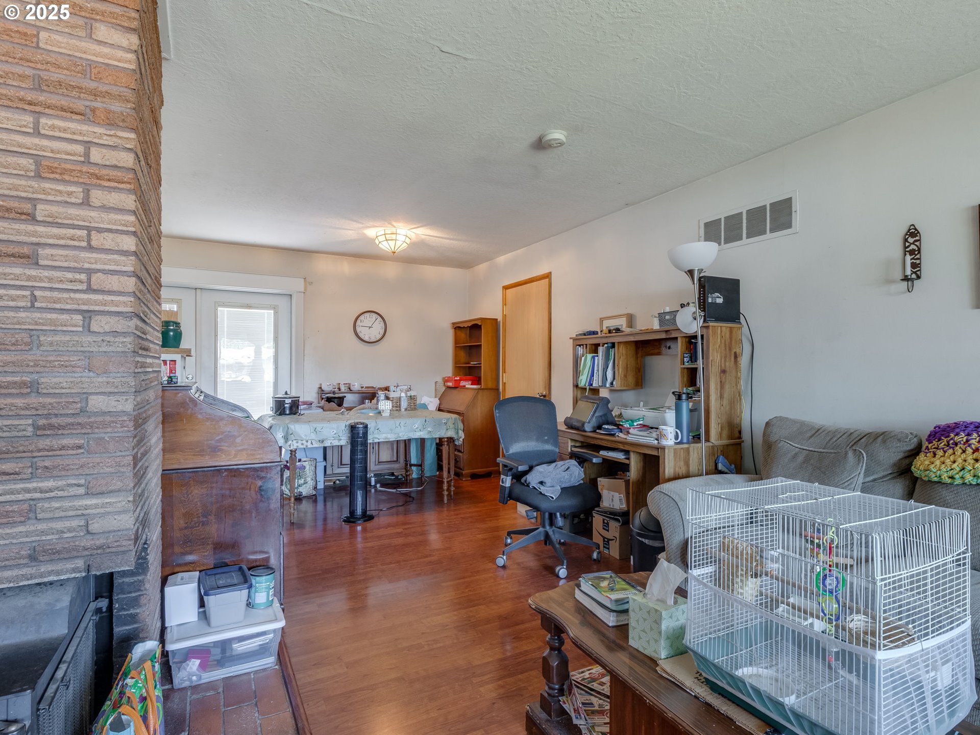 18010 Southeast Stephens Street Portland, OR 97233 - Photo 10 of 30 a living room with furniture and wooden floor