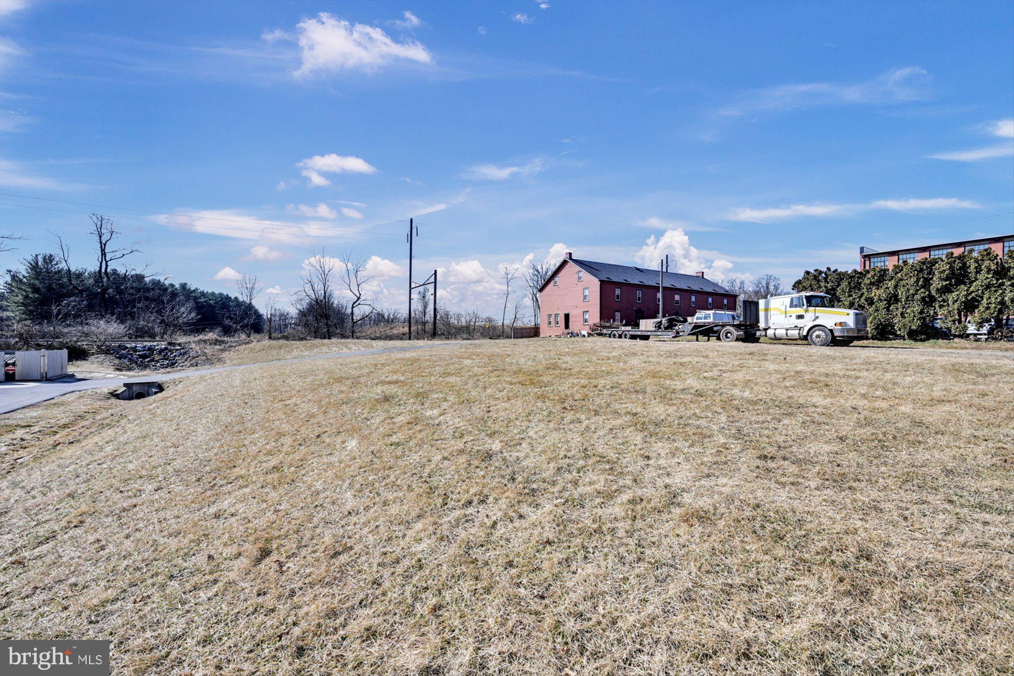 400 East Main Street Mount Joy, PA 17552 - Photo 6 of 10 a view of a house with a yard and garage
