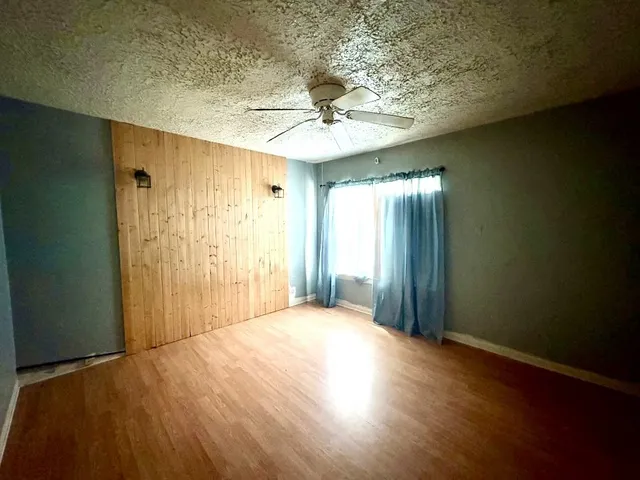 a view of a livingroom with a chandelier fan