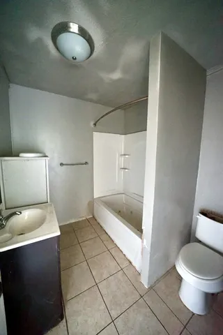 a bathroom with a toilet and a sink