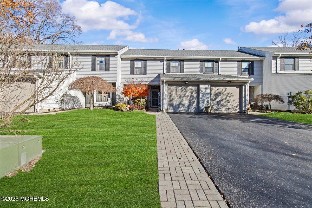 94 Paddock Court Oceanport, NJ 07757 - Photo 11 of 38 a front view of a house with garden