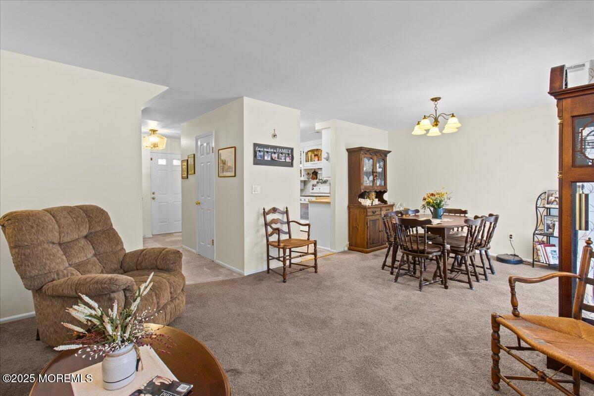 94 Paddock Court Oceanport, NJ 07757 - Photo 15 of 38 a living room with furniture and wooden floor