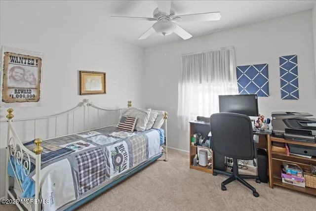 a bedroom with a bed and a chair