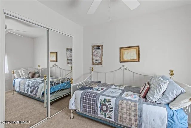 a bedroom with bed and wooden floor