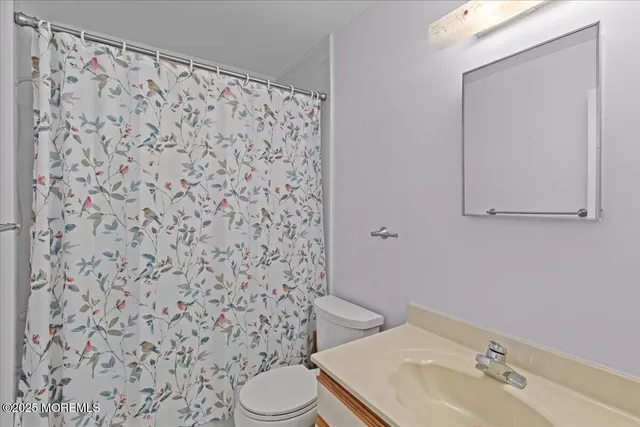 a bathroom with a toilet and a sink
