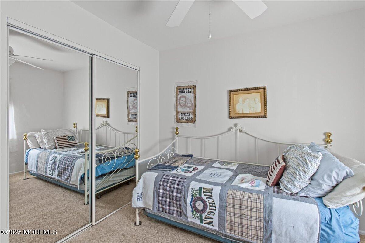 94 Paddock Court Oceanport, NJ 07757 - Photo 28 of 38 a bedroom with bed and wooden floor