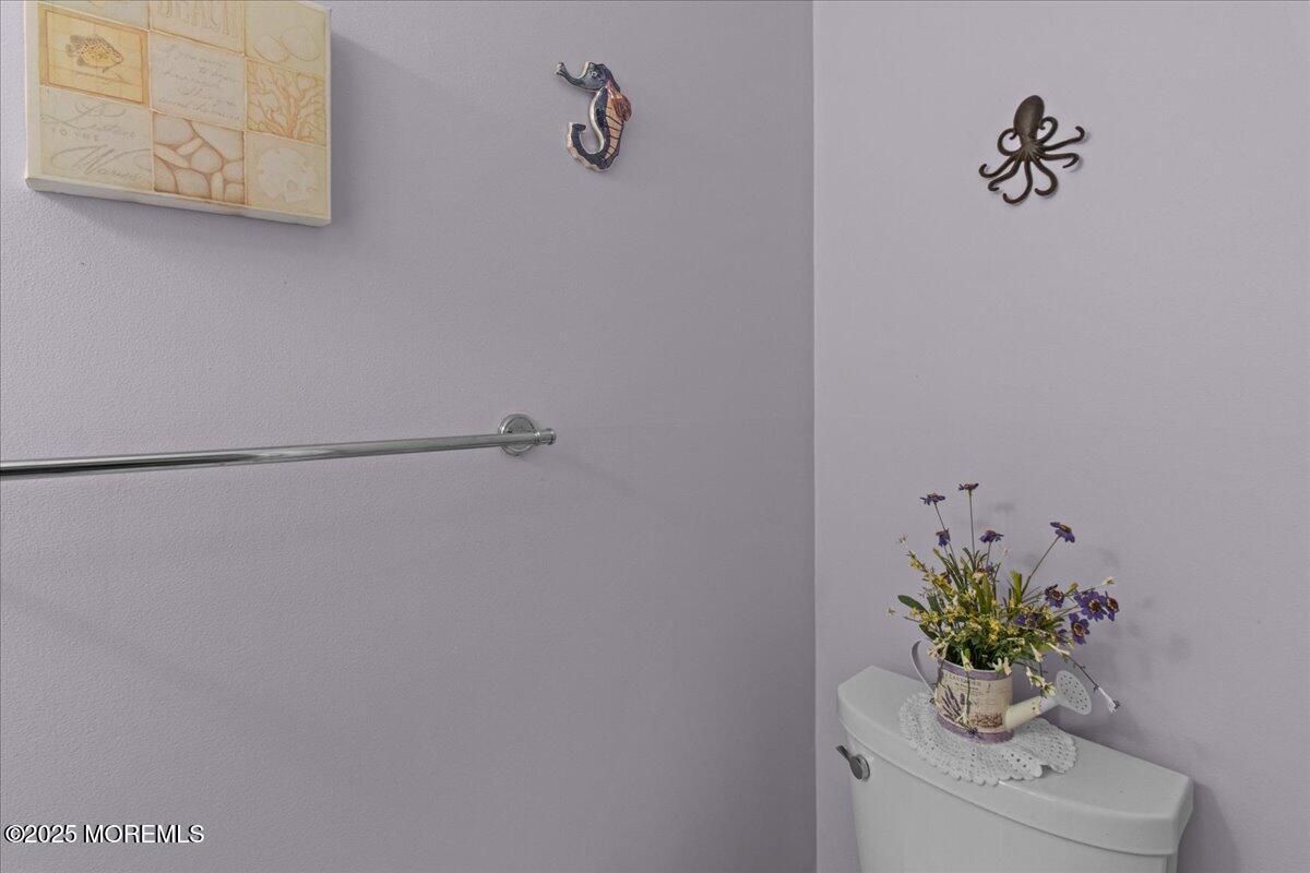 94 Paddock Court Oceanport, NJ 07757 - Photo 30 of 38 a white vase with flowers