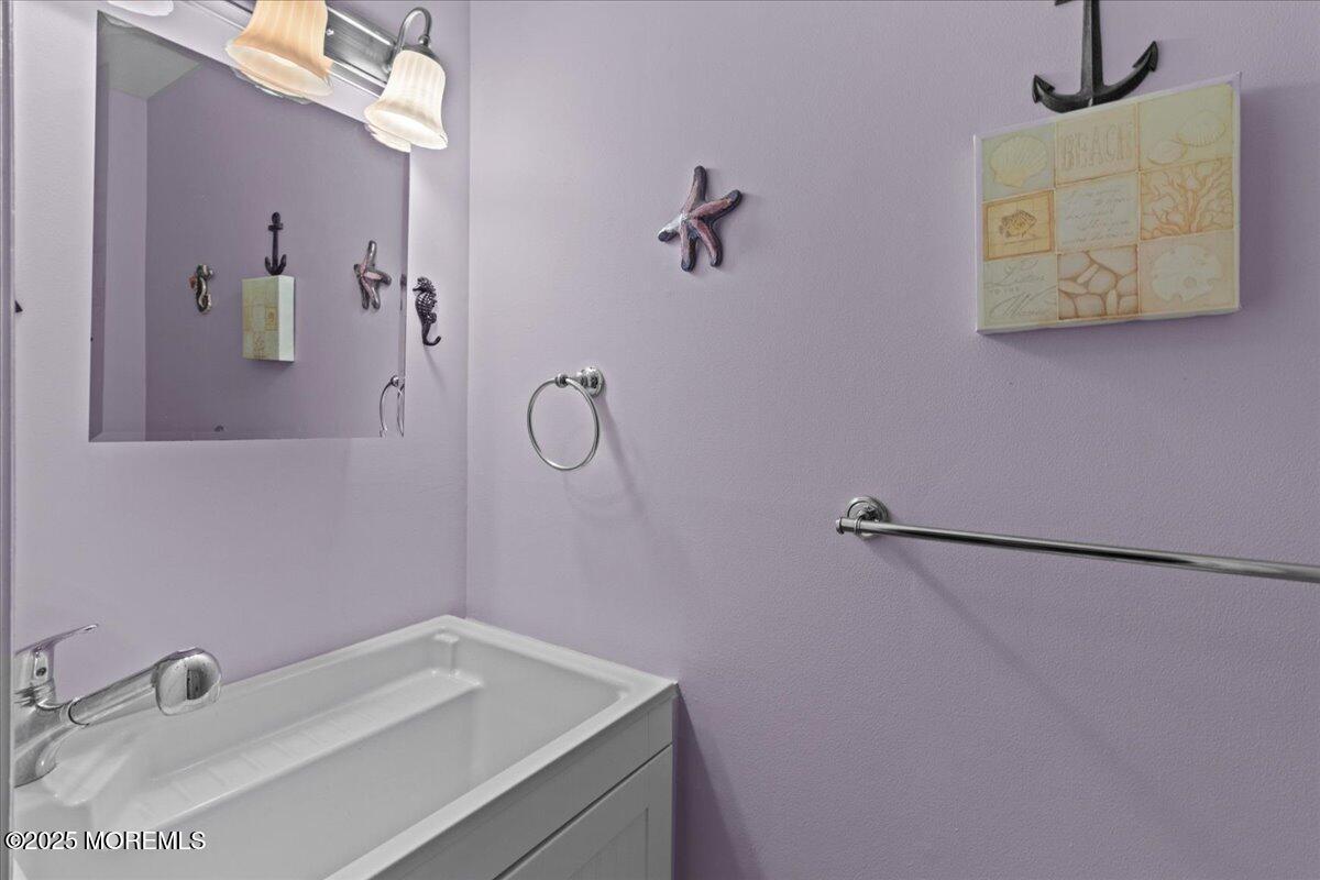 94 Paddock Court Oceanport, NJ 07757 - Photo 31 of 38 a bathroom with a sink and vanity