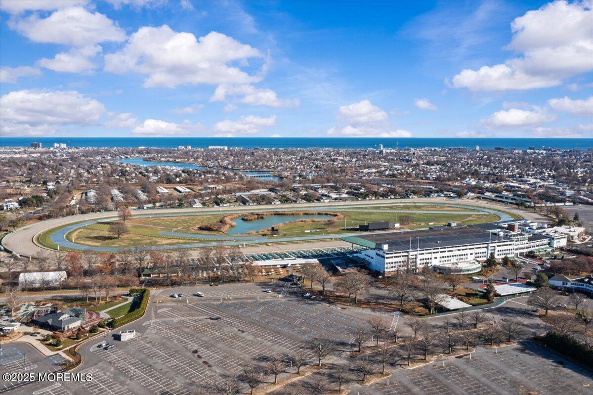 94 Paddock Court Oceanport, NJ 07757 - Photo 37 of 38 a view of a lake with a city