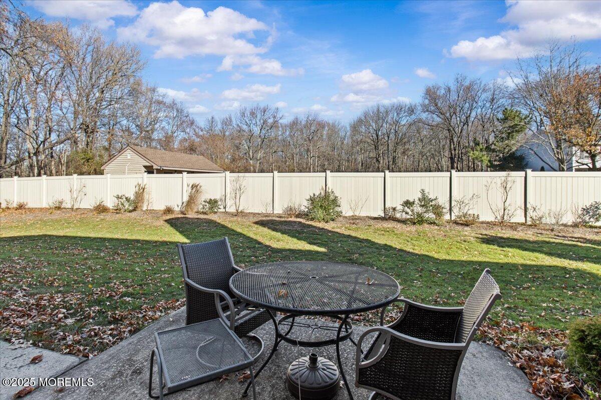 94 Paddock Court Oceanport, NJ 07757 - Photo 10 of 38 a view of a table and chairs in backyard of the house