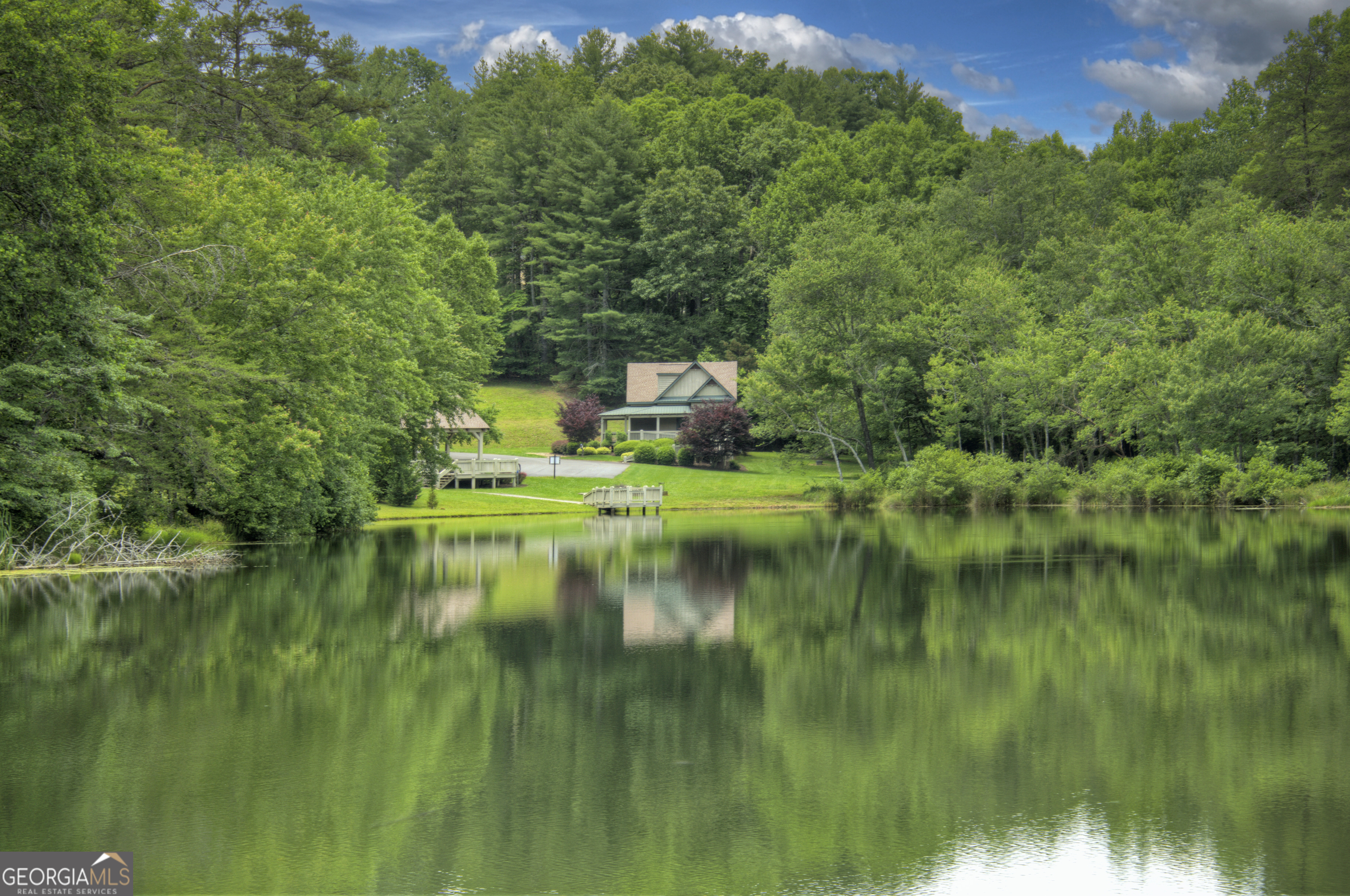 Lot 132 Fox Cove Road, Unit 132 Blairsville, GA 30512 - Photo 34 of 41 a view of a lake with a house in the background