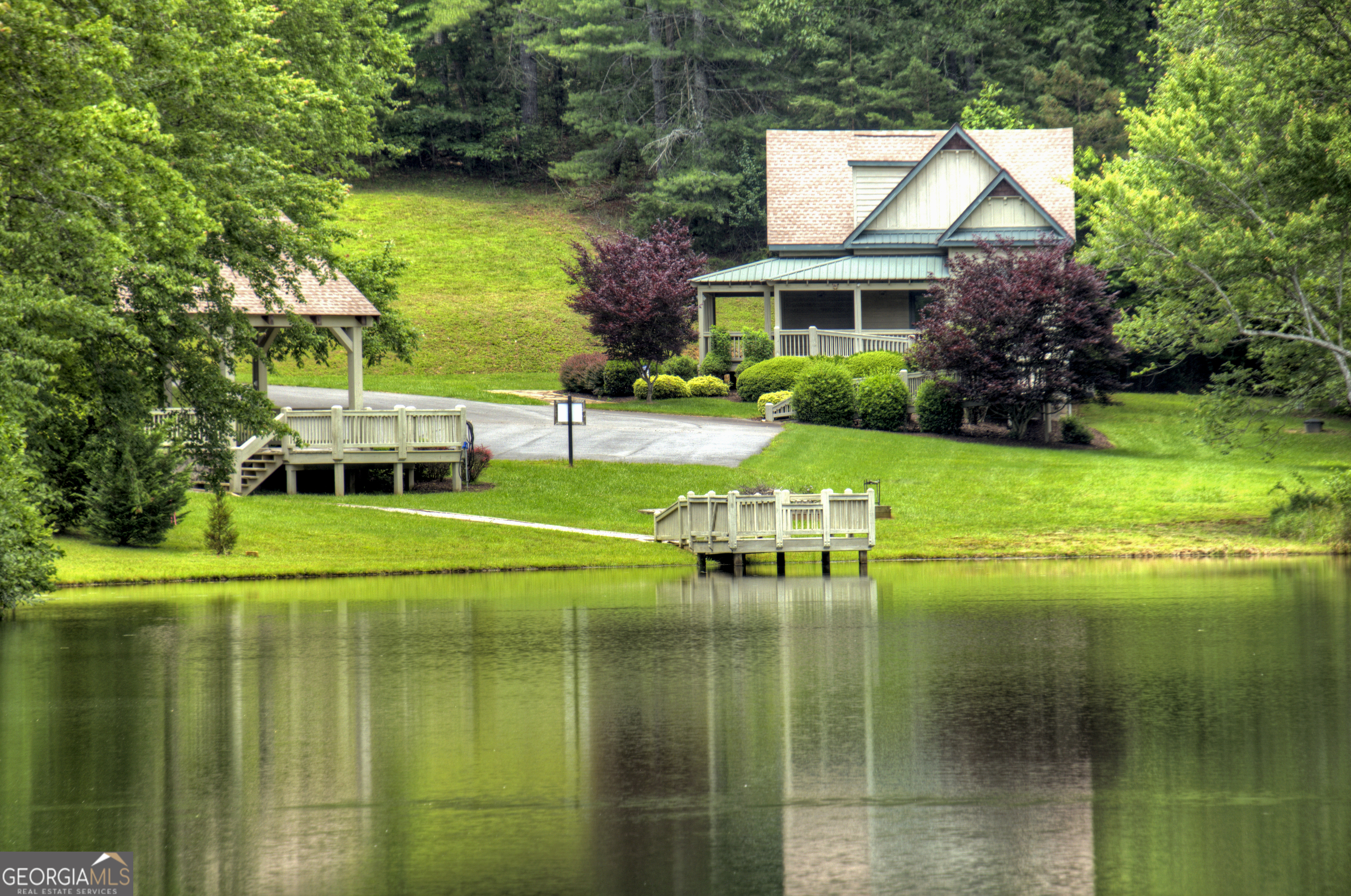 Lot 132 Fox Cove Road, Unit 132 Blairsville, GA 30512 - Photo 36 of 41 a front view of a house with a yard table and chairs