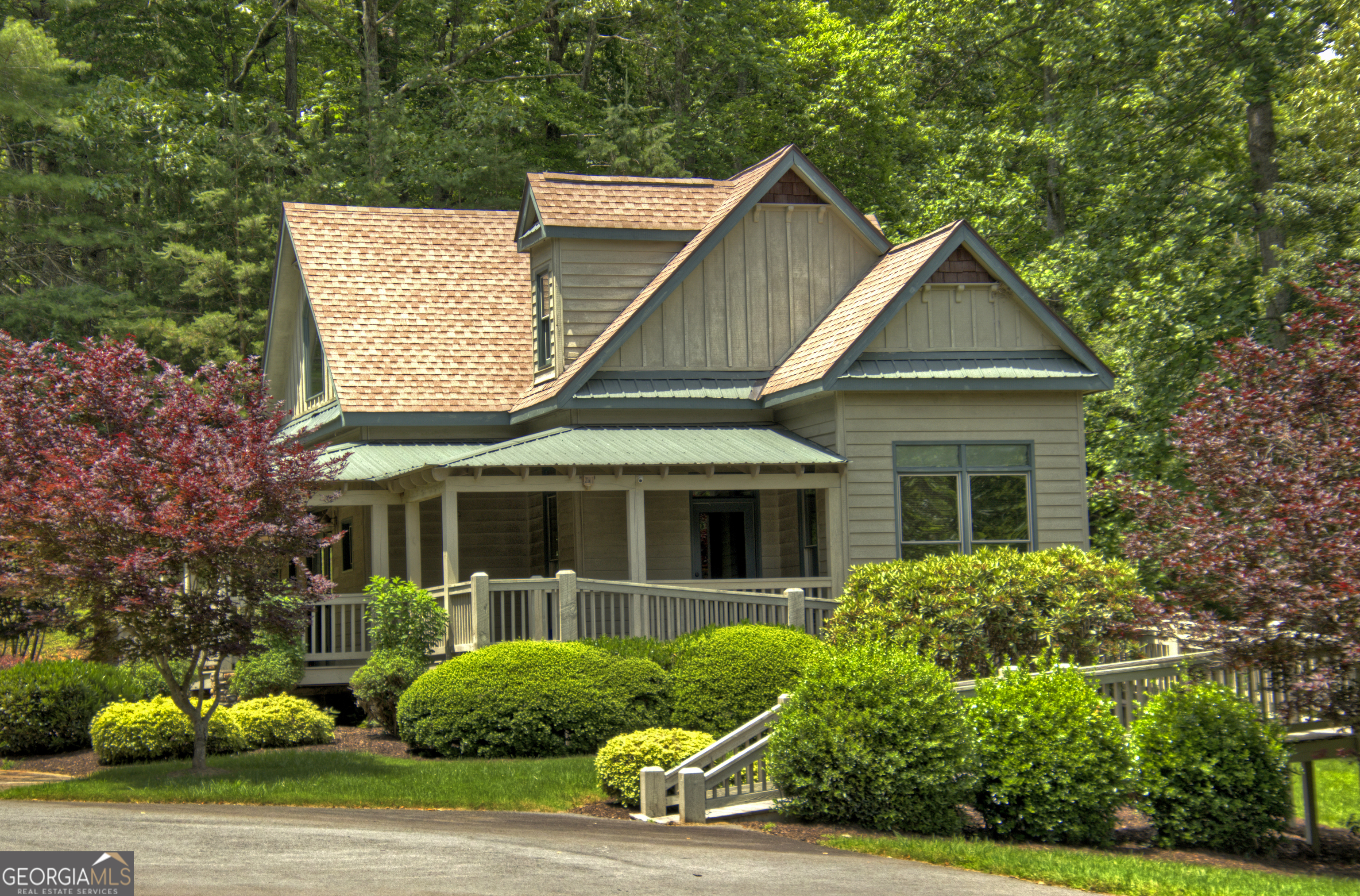 Lot 132 Fox Cove Road, Unit 132 Blairsville, GA 30512 - Photo 37 of 41 a view of a white house with a small yard and plants