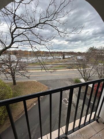 43 A Seaview Avenue, Unit 12 Stamford, CT 06902 - Photo 7 of 10 a view of a balcony with wooden fence
