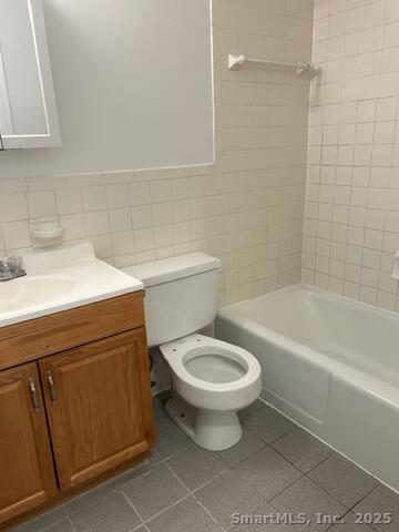 43 A Seaview Avenue, Unit 12 Stamford, CT 06902 - Photo 8 of 10 a bathroom with a sink a toilet and bathtub