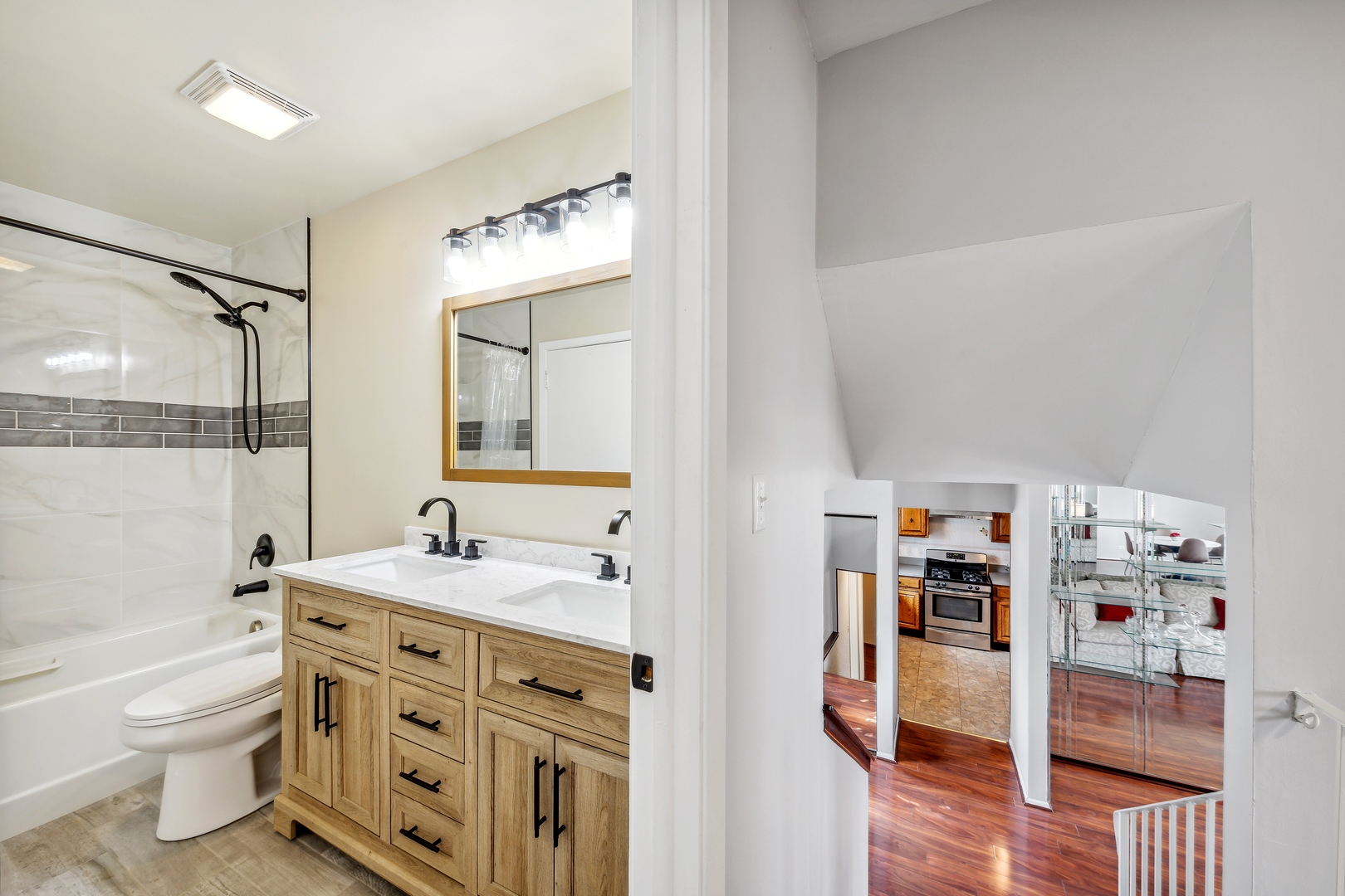 5750 Timberlane Road Matteson, IL 60443 - Photo 8 of 15 a bathroom with a double vanity sink a toilet and shower