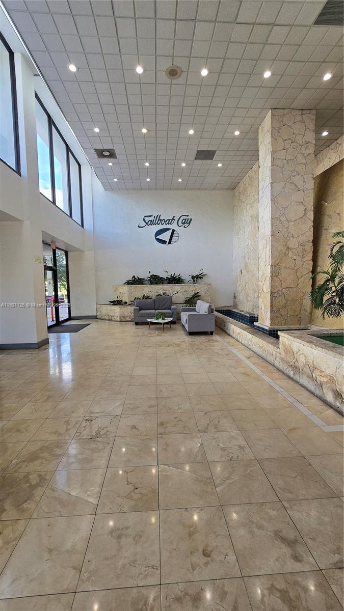 13499 Biscayne Boulevard, Unit 1103 North Miami, FL 33181 - Photo 16 of 20 a view of a hall with stairs