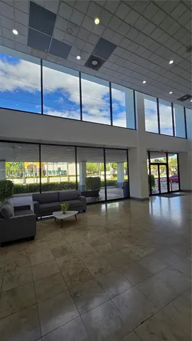 a lobby with furniture and window