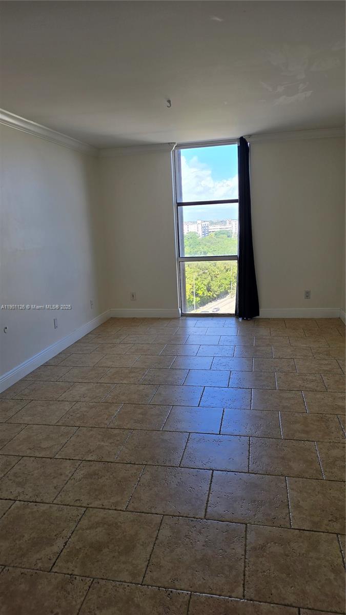 13499 Biscayne Boulevard, Unit 1103 North Miami, FL 33181 - Photo 9 of 20 a view of an empty room with a window