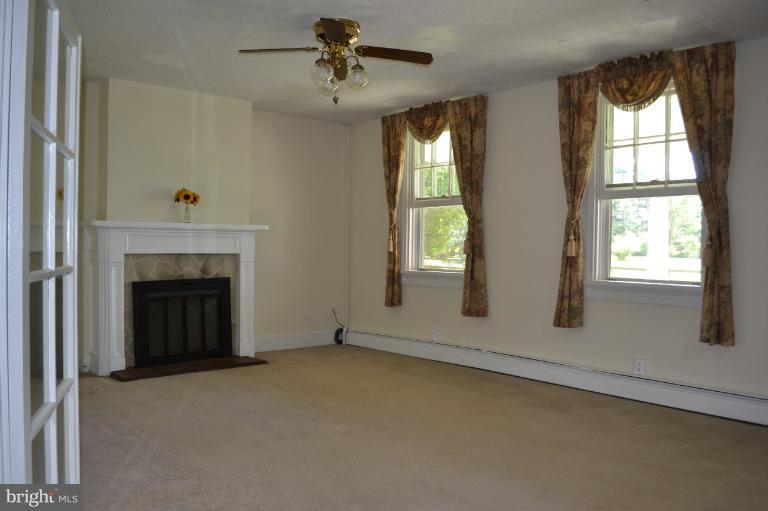 1009 Calvert Road Rising Sun, MD 21911 - Photo 12 of 30 Living Rom w/ Gas Fireplace & door to front porch